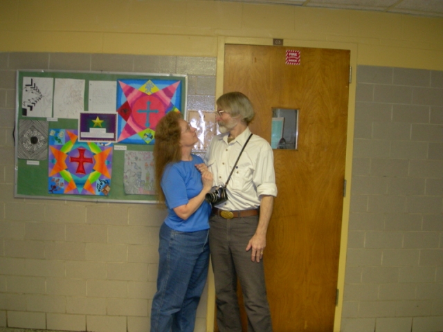 Jennie and Michael Fleming standing in the spot they met in 1968 (outside art room door)