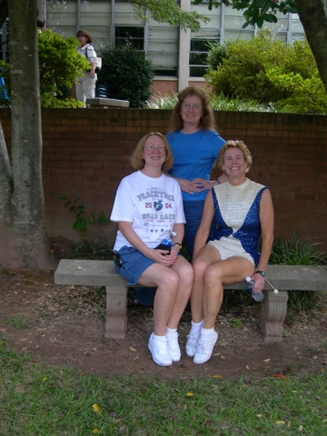 McCorvey family girls in courtyard (seated:  Diane 68, Gail 73, majorette, standing: Jennie M. Fleming 72, also majorette